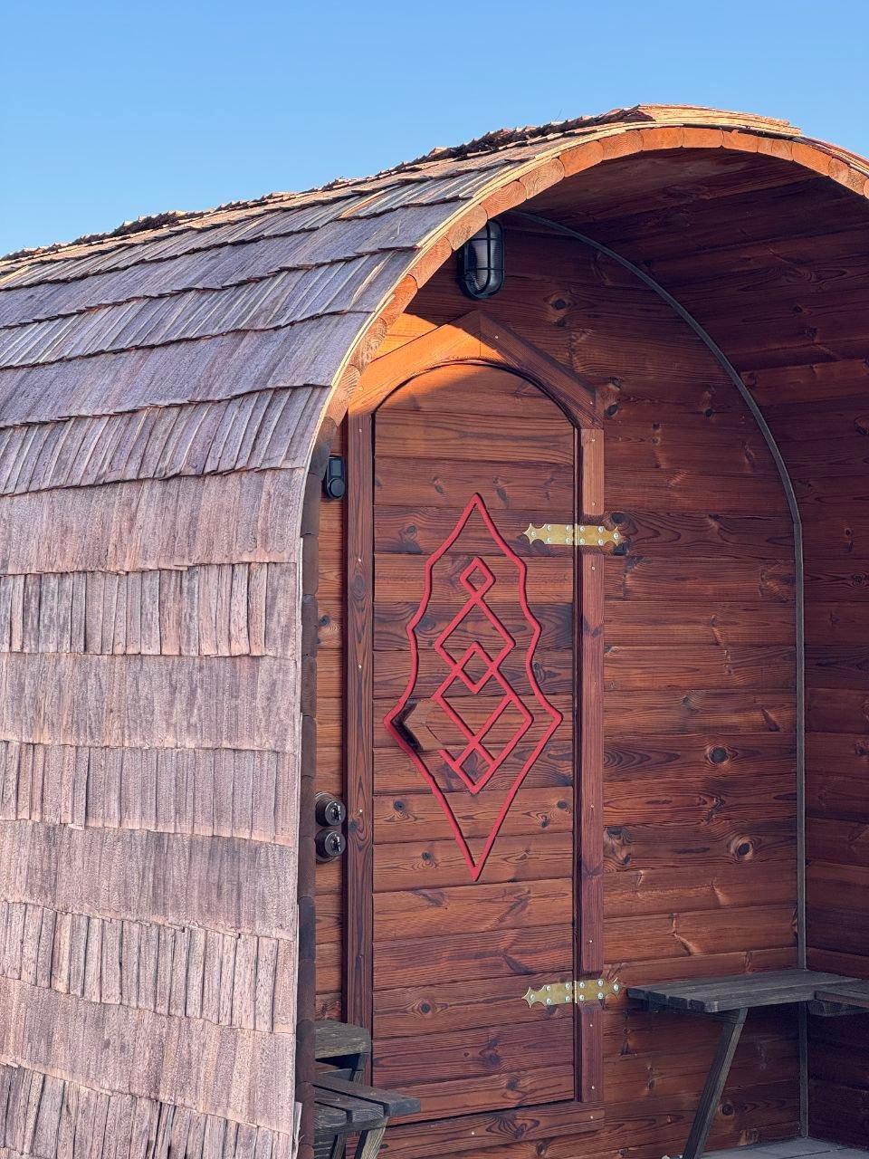 Laznya entrance door with ornate woodwork