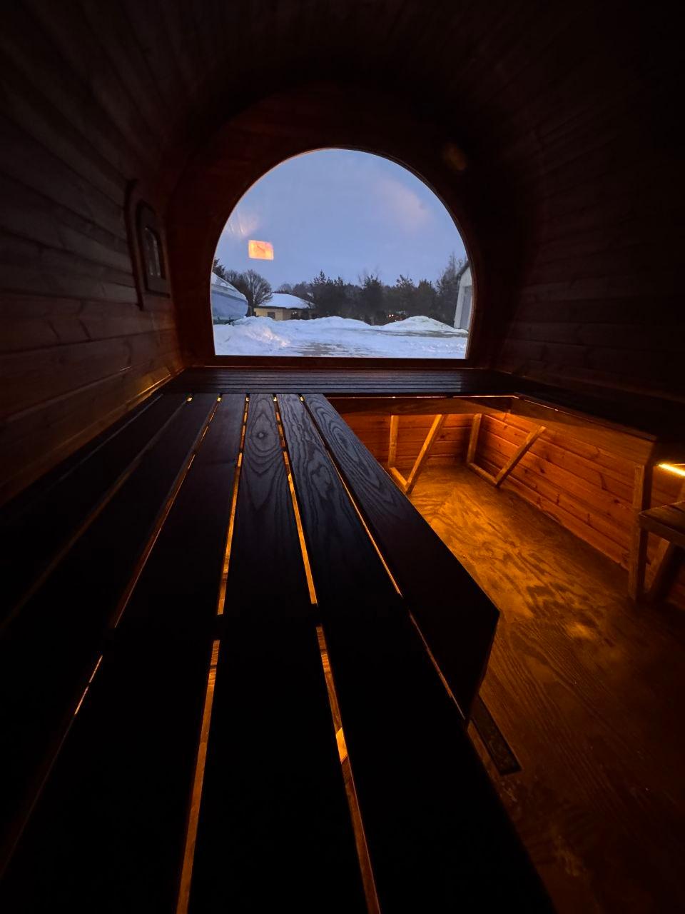 Interior bench with oval window view